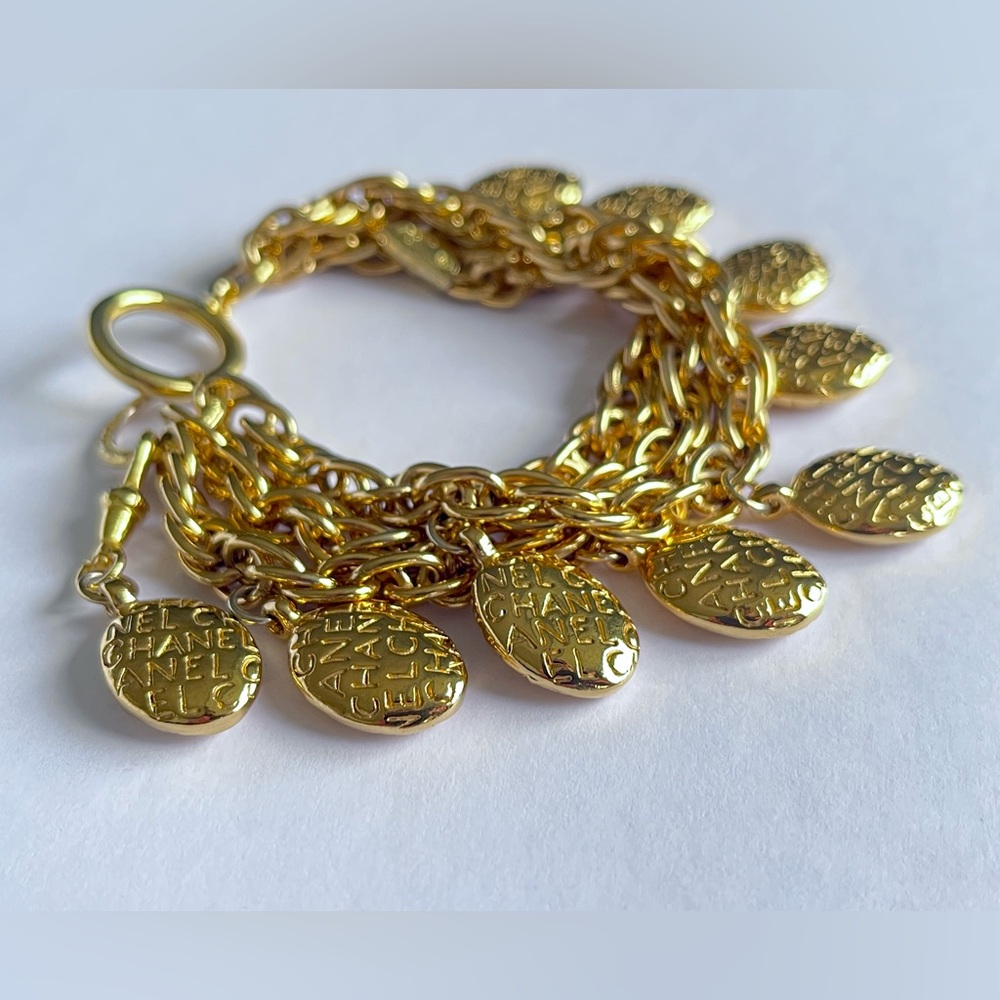 CHANEL Vintage Triple Strand Logo Bracelet. 24k gold plated. Namesake EUC,1970’s